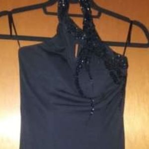 Formal black beaded dress with peacock  hair accessory